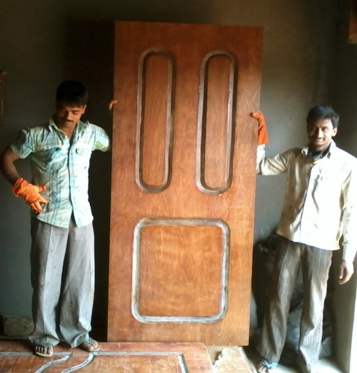 COMPLETED MOLDED DOOR (Two Skilled Workers, standing)