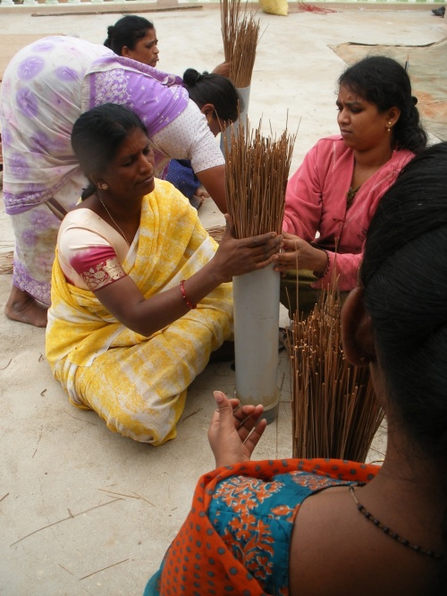 TRAINED WOMEN WORKING WITH COCONUT SPLINTERS